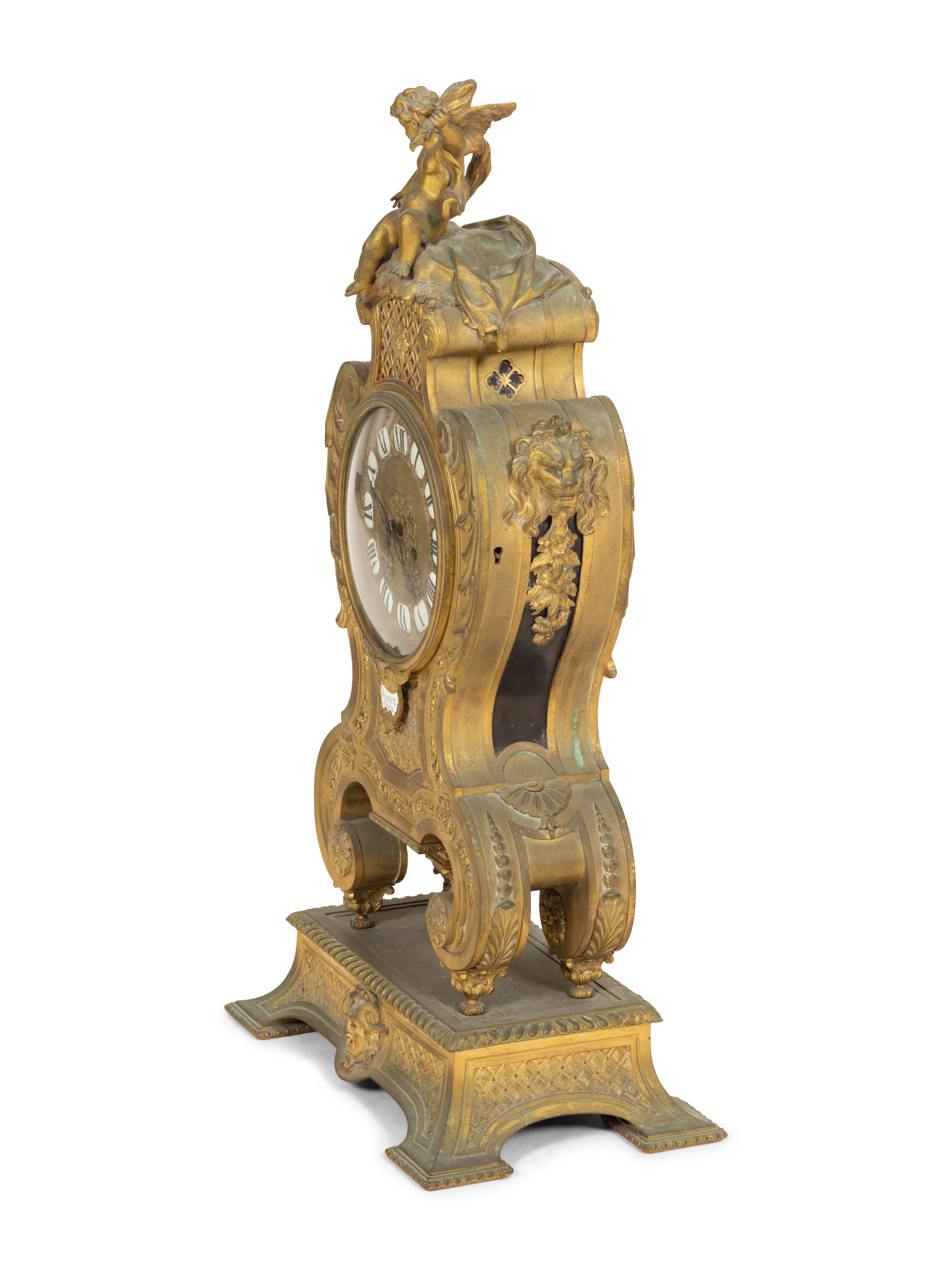 A Louis XV Style Gilt Bronze Mantle Clock on Stand