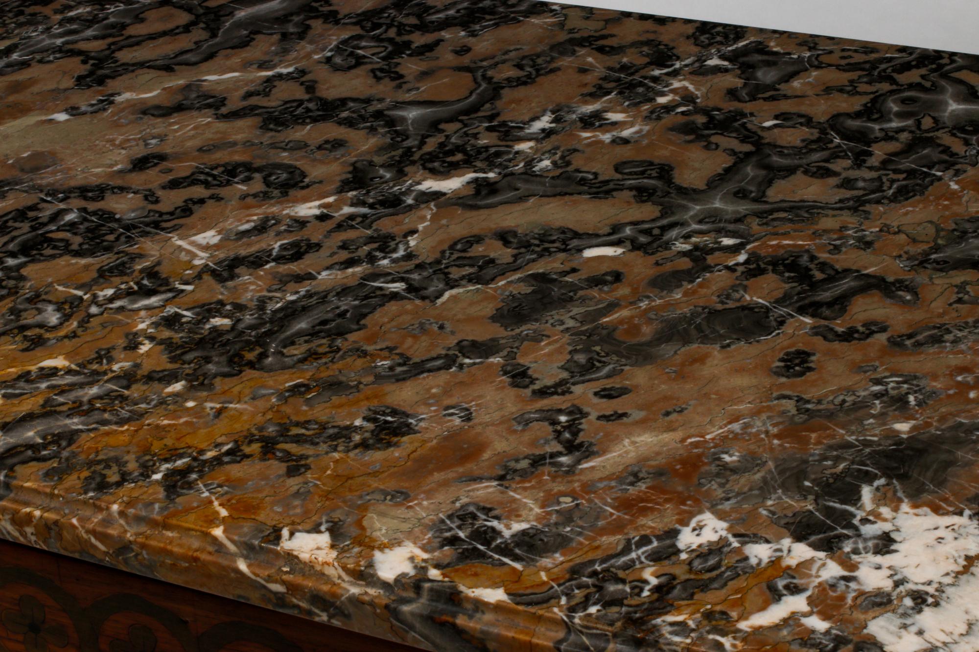 A French Transitional Marquetry Marble-Top Commode