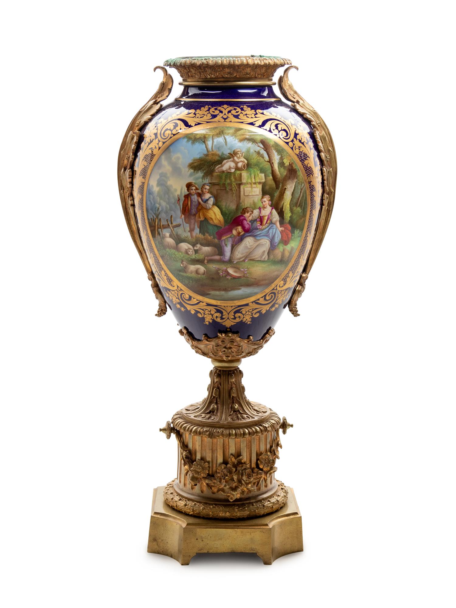 A Sèvres Style Gilt Bronze Mounted Painted and Parcel Gilt Porcelain Urn
