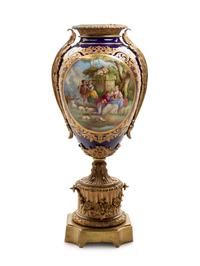 A Sèvres Style Gilt Bronze Mounted Painted and Parcel Gilt Porcelain Urn