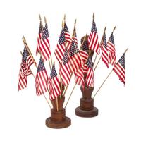 [FLAGS]. Two turned wooden flag holders. Late 19th-early 20th century.