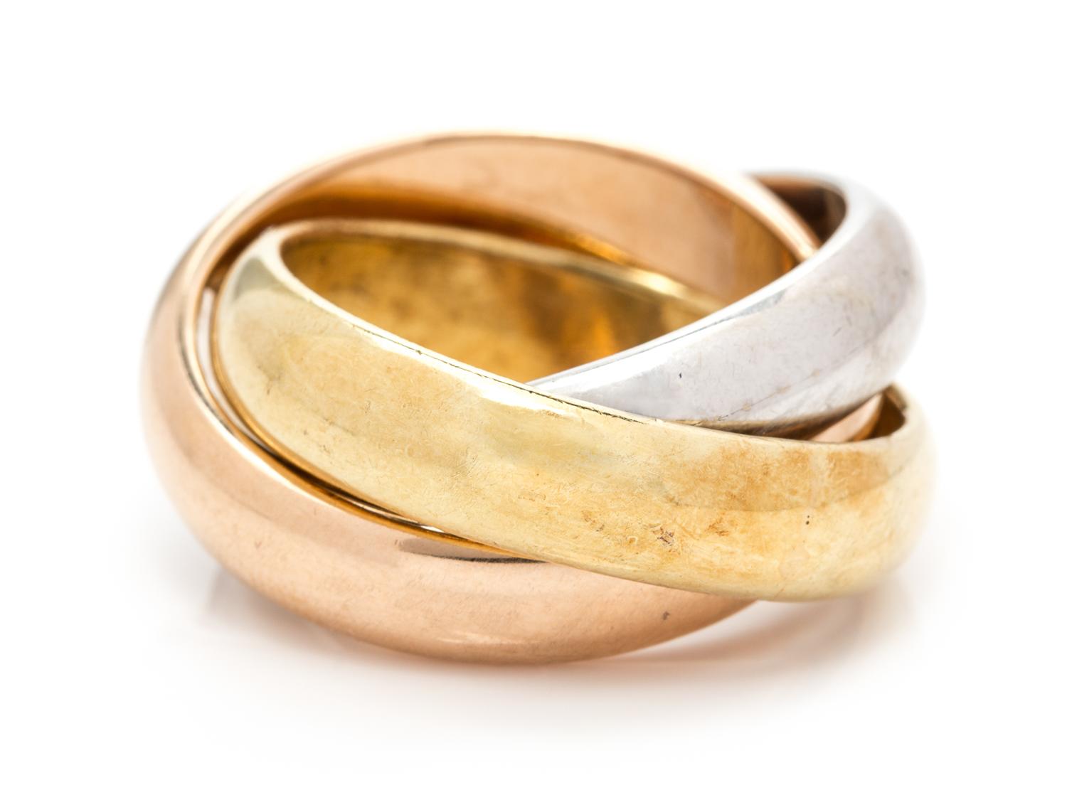 An 18 Karat Tricolor Gold Rolling Ring, 14.30 dwts.