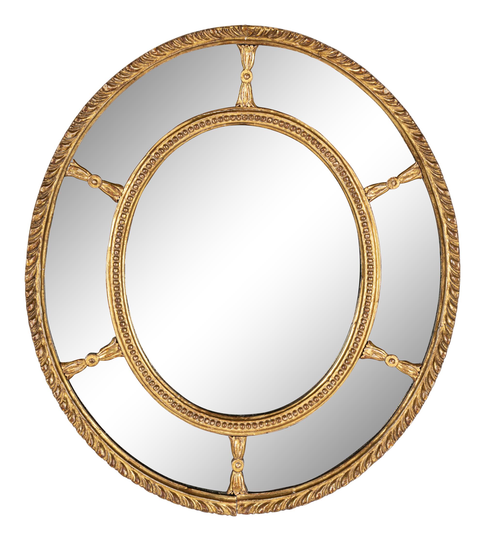 A Near Pair of George III Giltwood Oval Mirrors