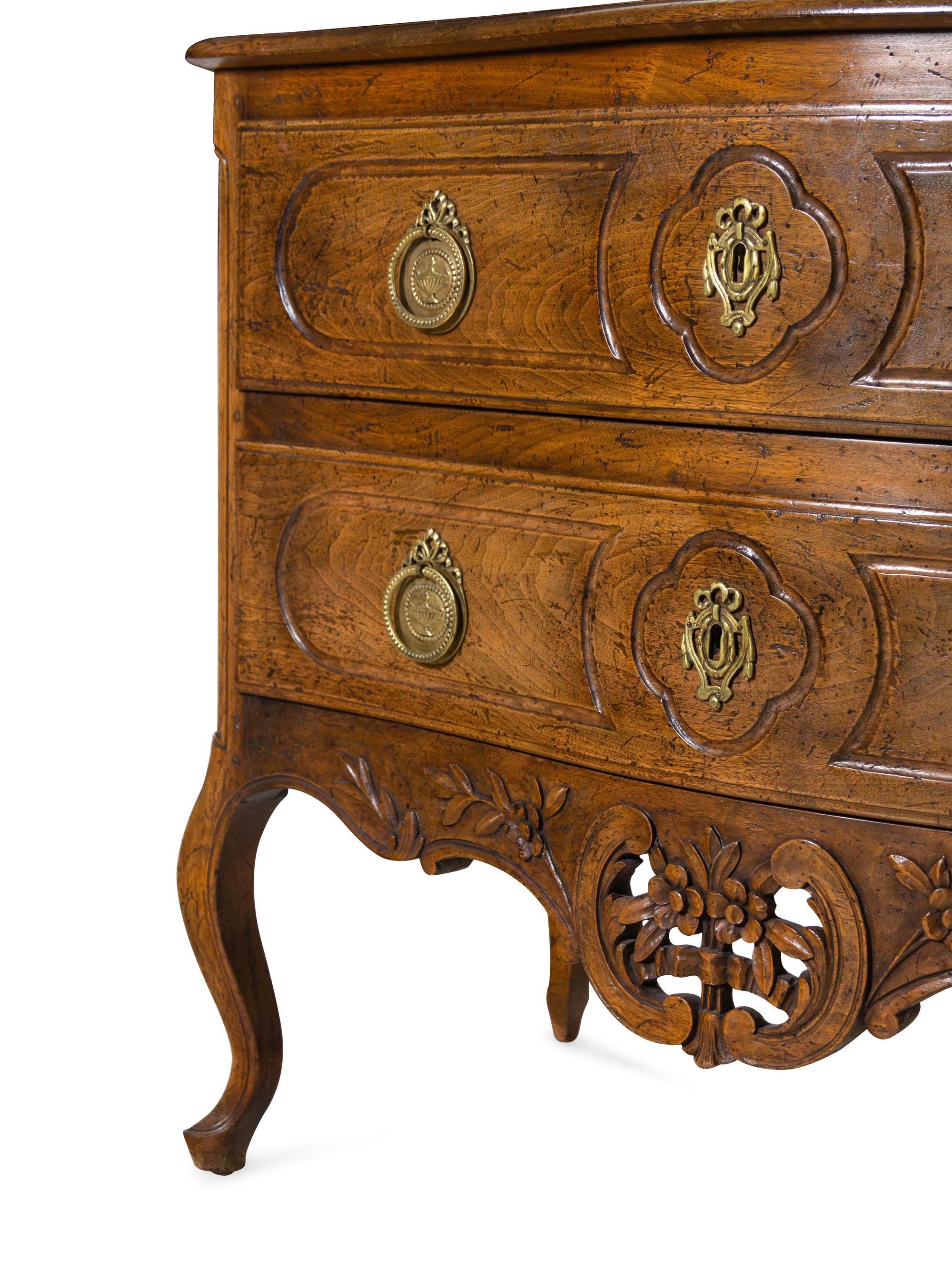 A Louis XV Style Walnut Commode
