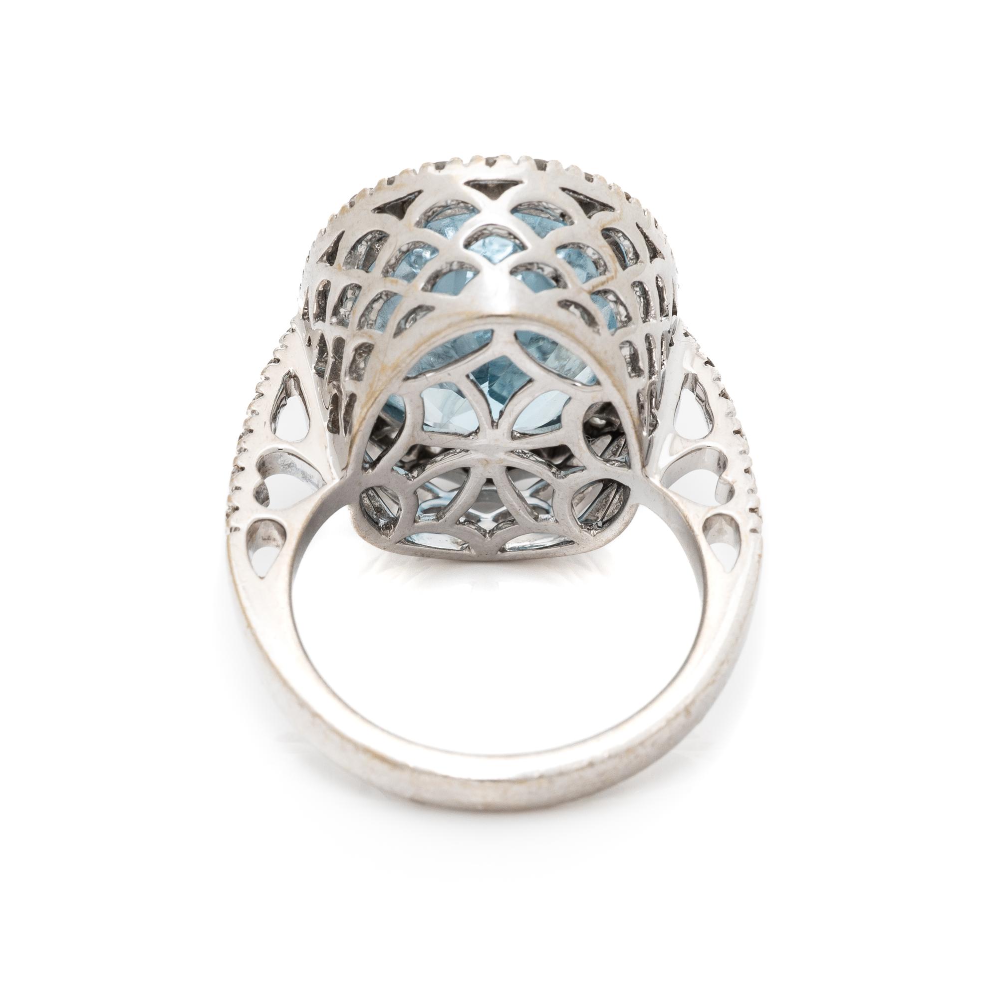 BLUE TOPAZ, DIAMOND, AND WHITE GOLD RING