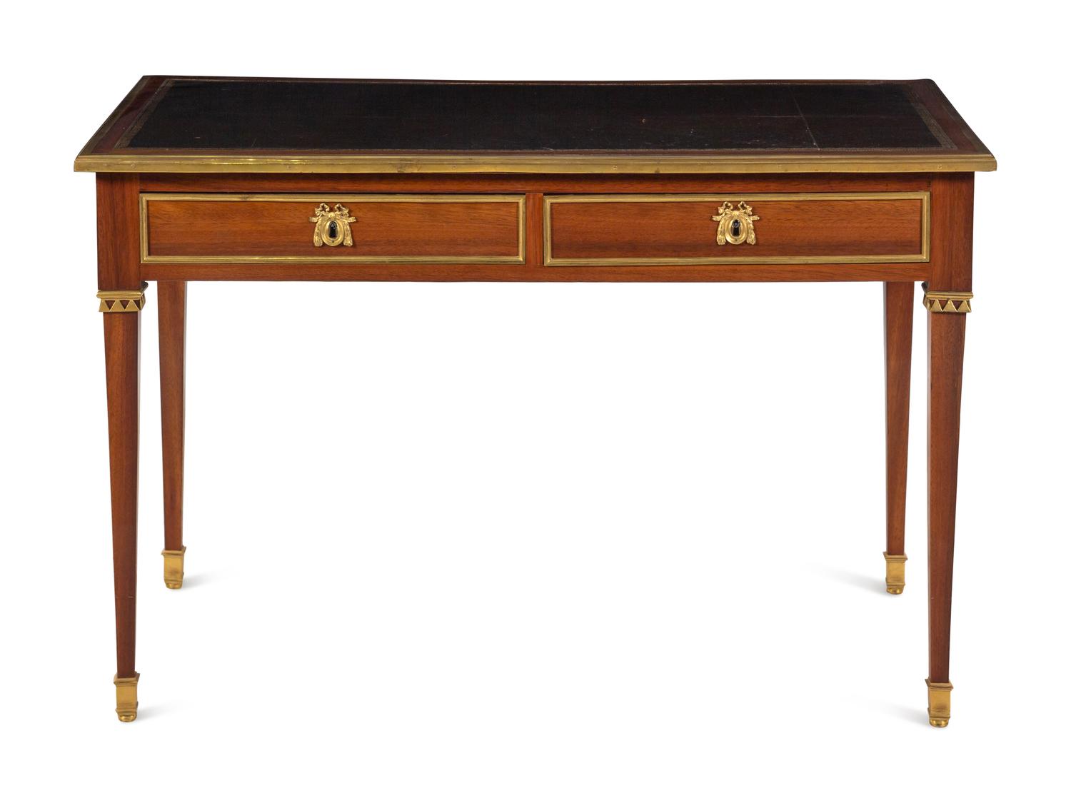 A Louis XVI Gilt Bronze Mounted Mahogany Bureau Plat by Claude-Charles Saunier (French, 1735-1807)