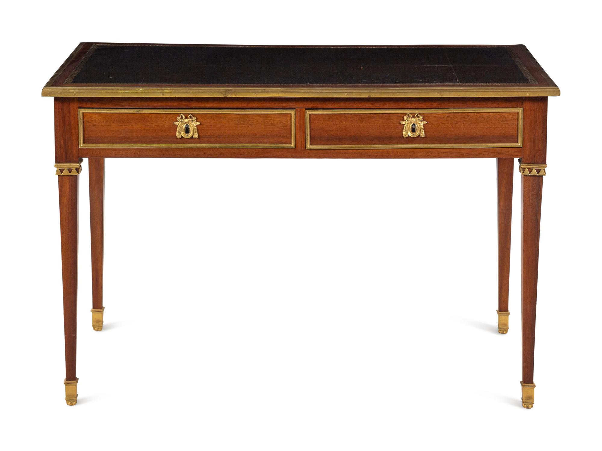 A Louis XVI Gilt Bronze Mounted Mahogany Bureau Plat by Claude-Charles Saunier (French, 1735-1807)