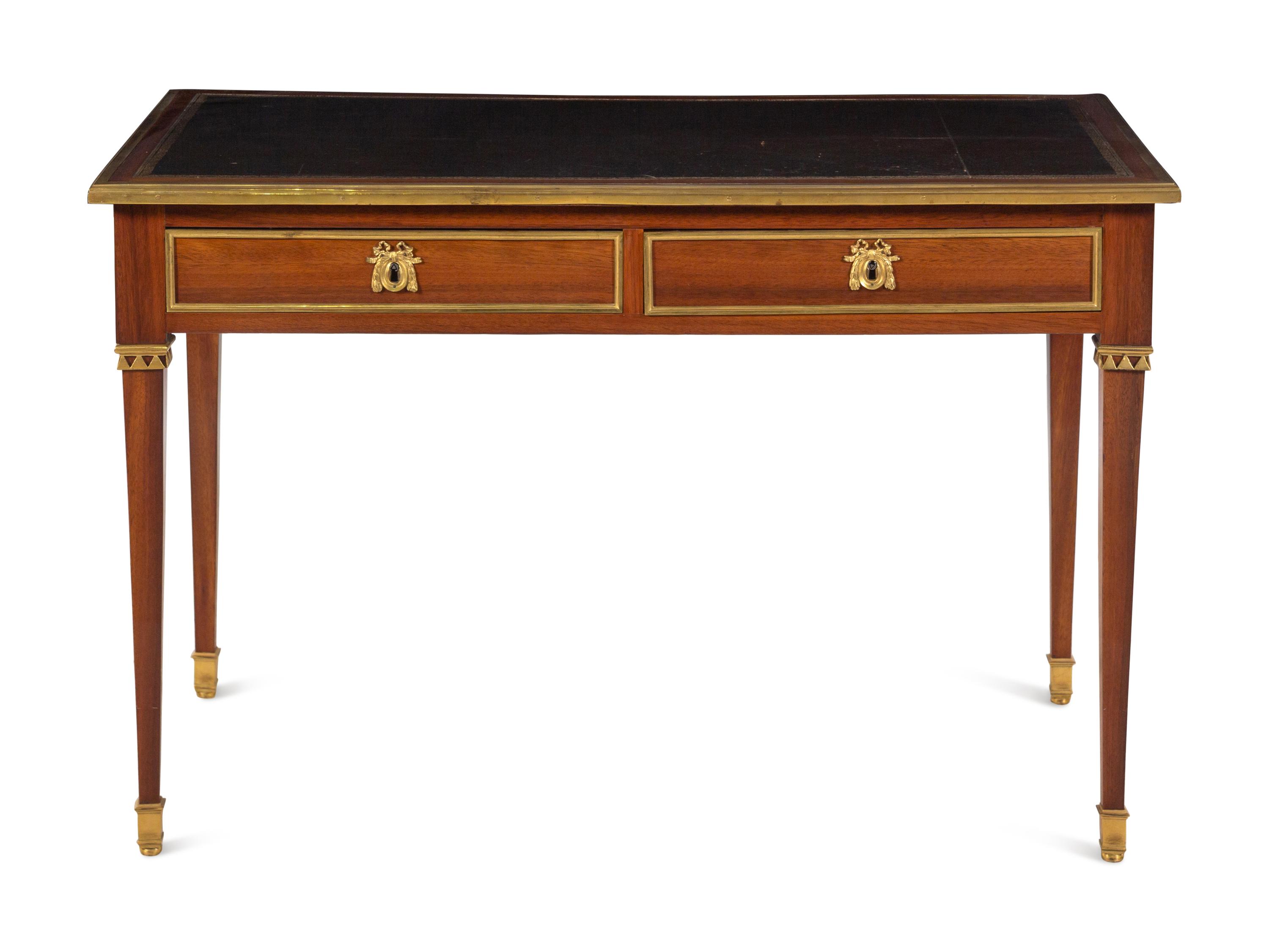A Louis XVI Gilt Bronze Mounted Mahogany Bureau Plat by Claude-Charles Saunier (French, 1735-1807)