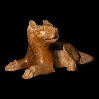 A Chinese Straw Glazed Pottery Figure of a Recumbent Dog, Han Dynasty 漢 陶臥犬