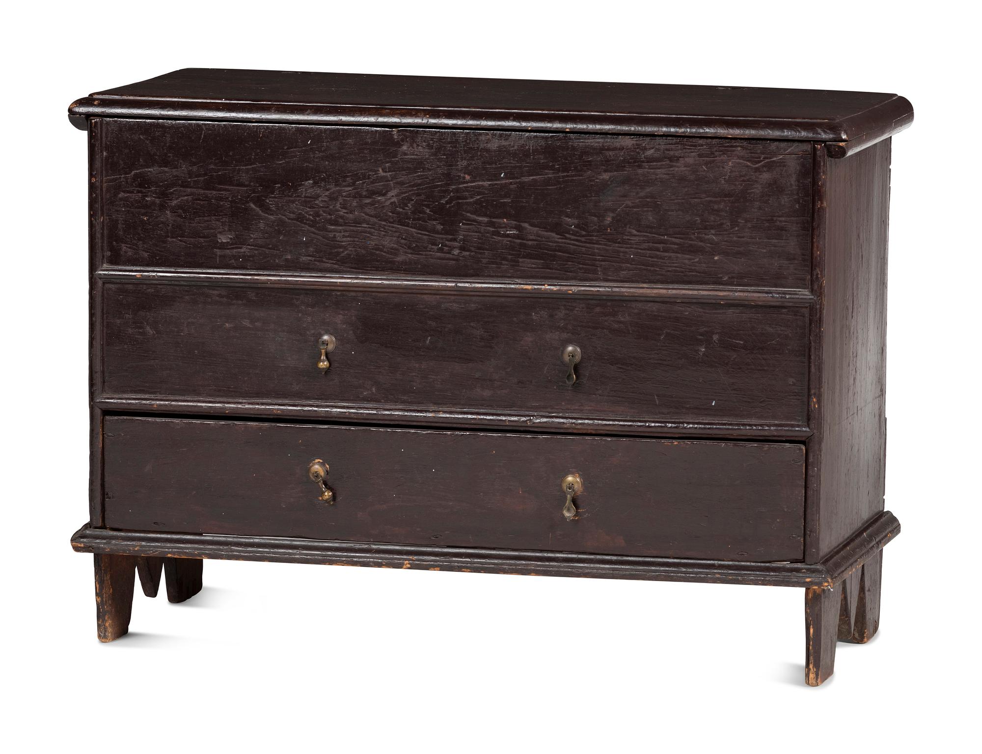 A Rare Pilgrim Century Black Painted Pine One-Drawer 'M' Chest