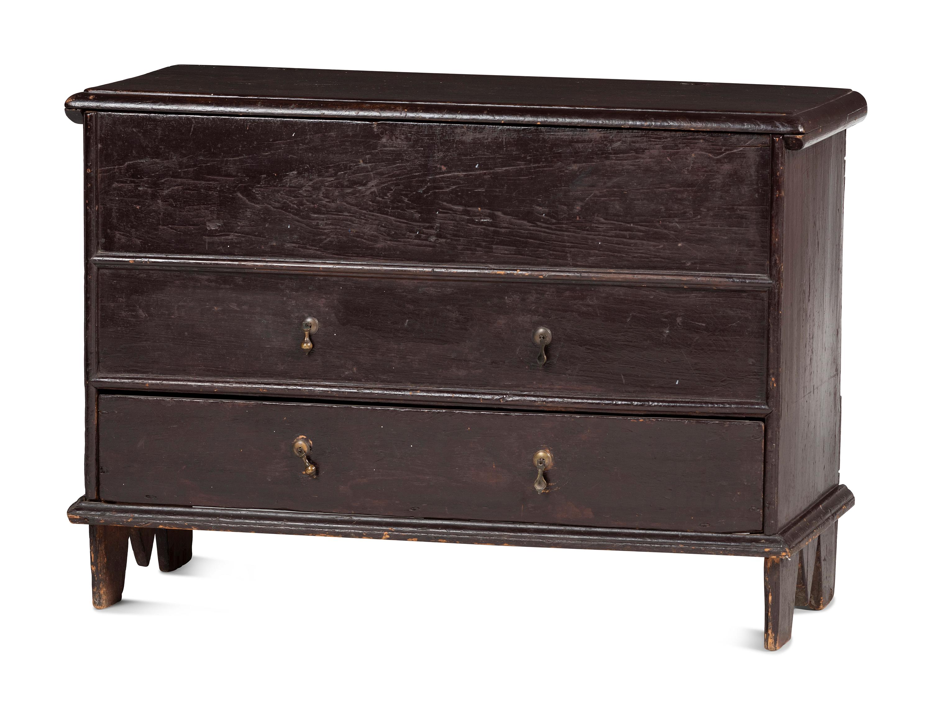 A Rare Pilgrim Century Black Painted Pine One-Drawer 'M' Chest