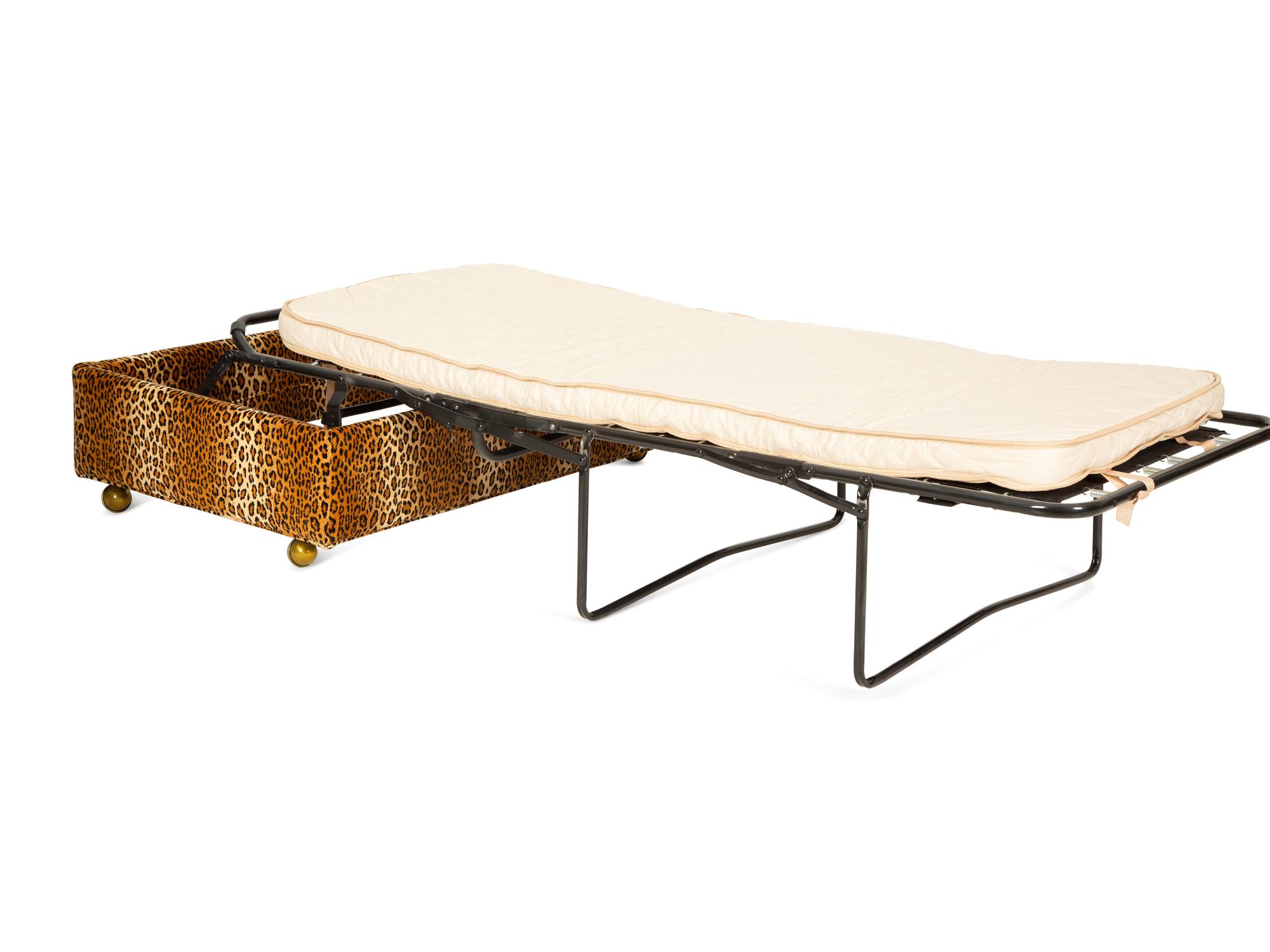 A Carlye Cheetah Print Upholstered Convertible Ottoman