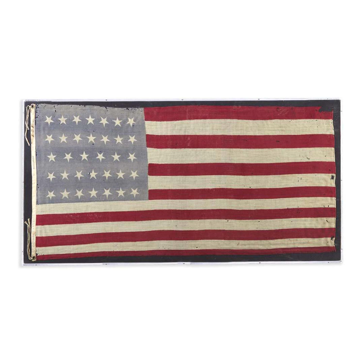 [FLAGS]. Civil War-era 34-star parade flag commemorating Kansas statehood. Ca 1861-1863.