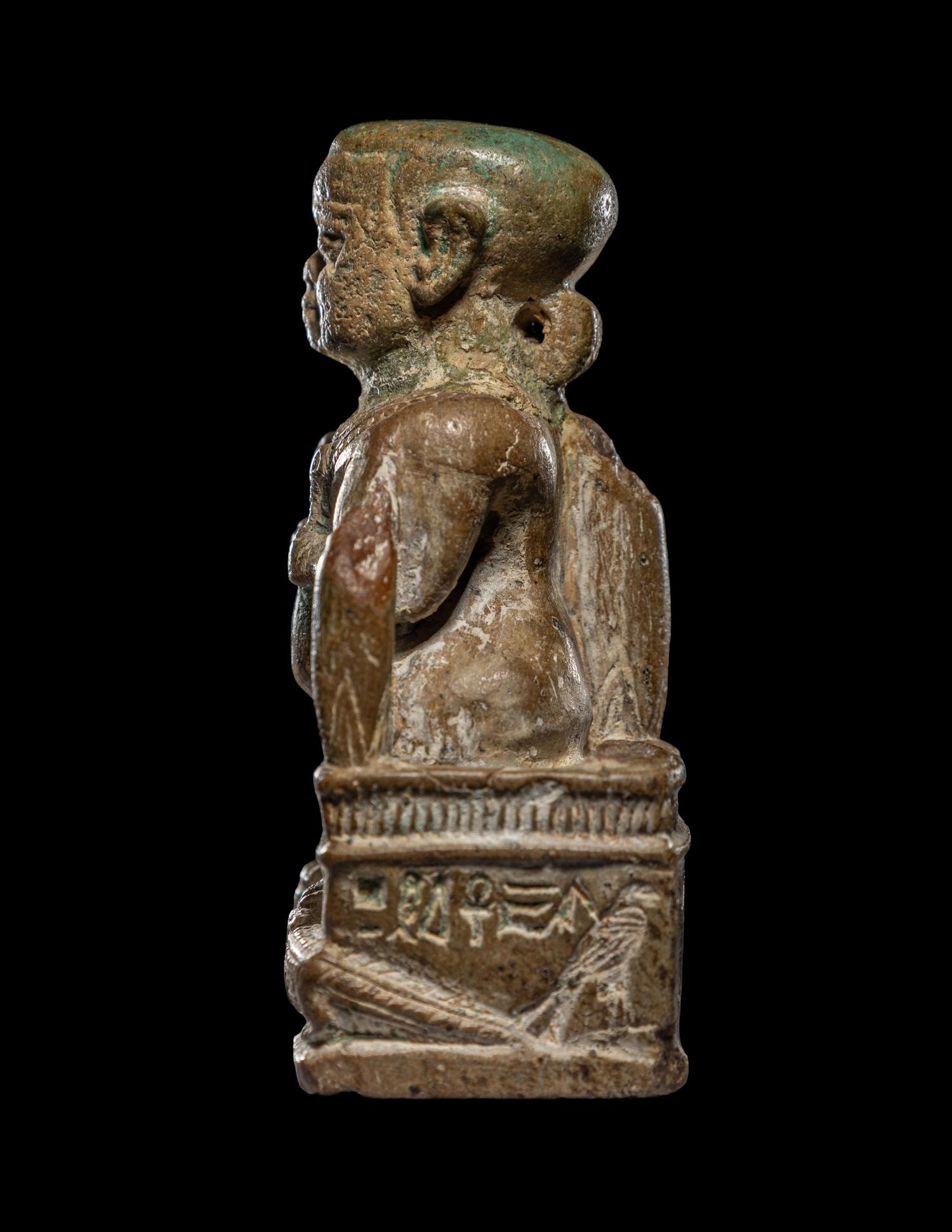 An Egyptian Glazed Steatite Amulet of Pataikos on Crocodiles