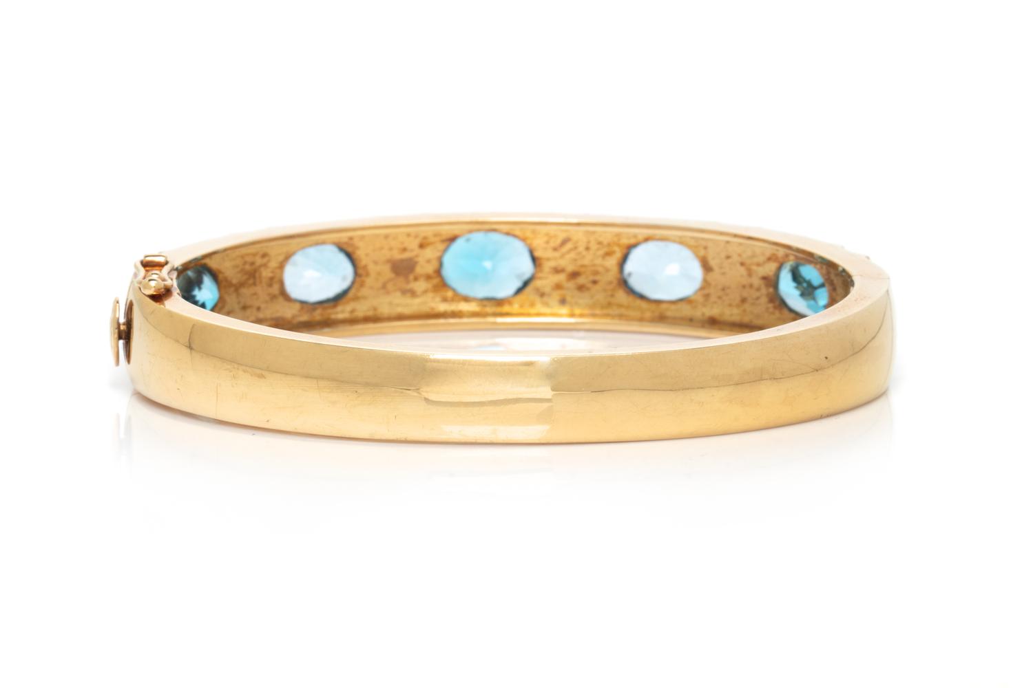 YELLOW GOLD AND BLUE TOPAZ BANGLE BRACELET