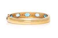 YELLOW GOLD AND BLUE TOPAZ BANGLE BRACELET