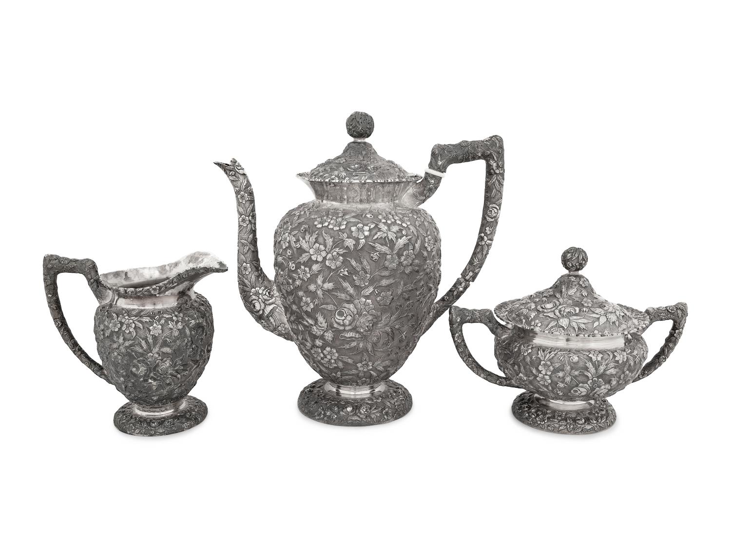 An American Silver Repoussé Three-Piece Coffee Service