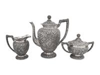 An American Silver Repoussé Three-Piece Coffee Service