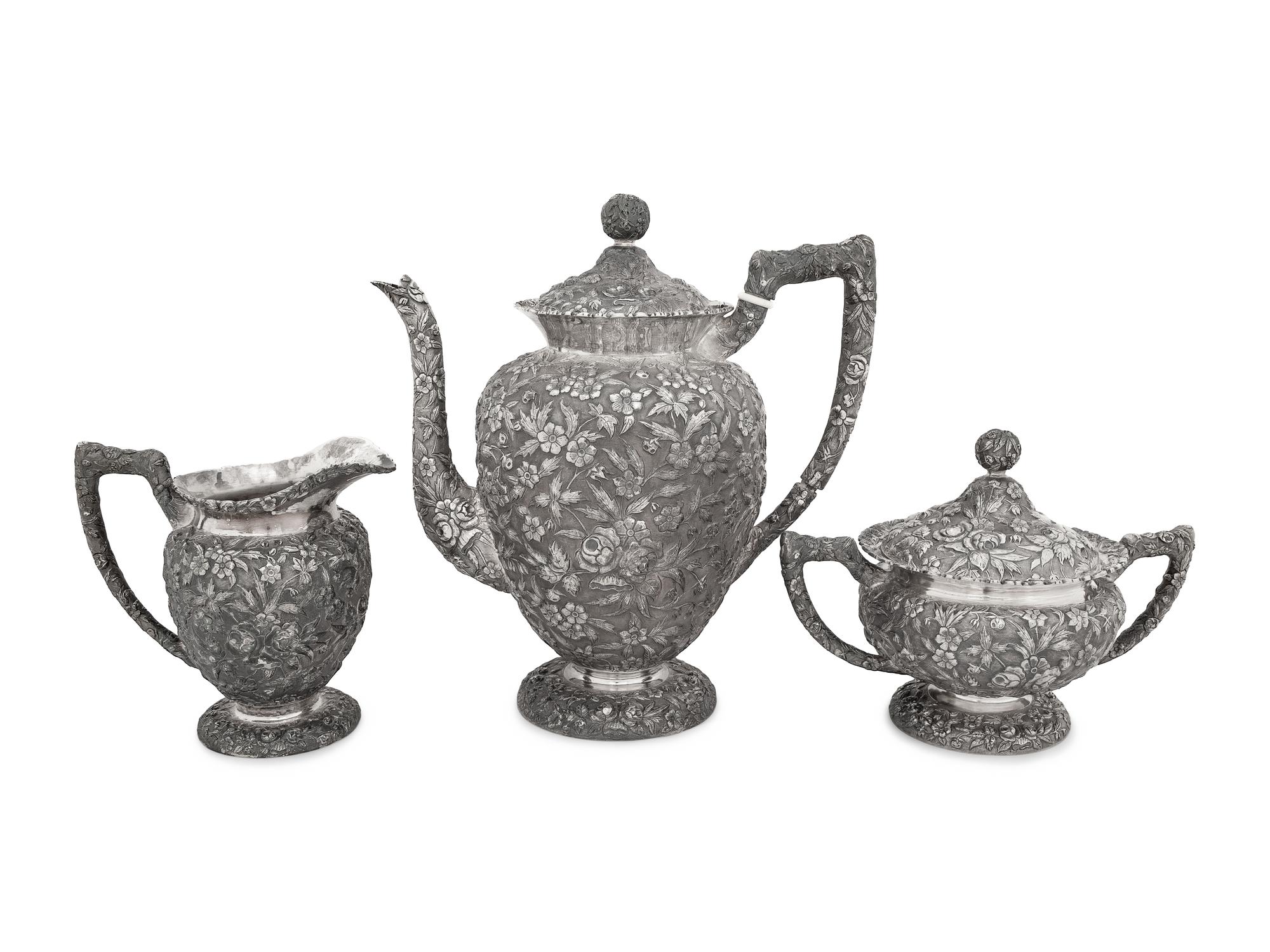 An American Silver Repoussé Three-Piece Coffee Service