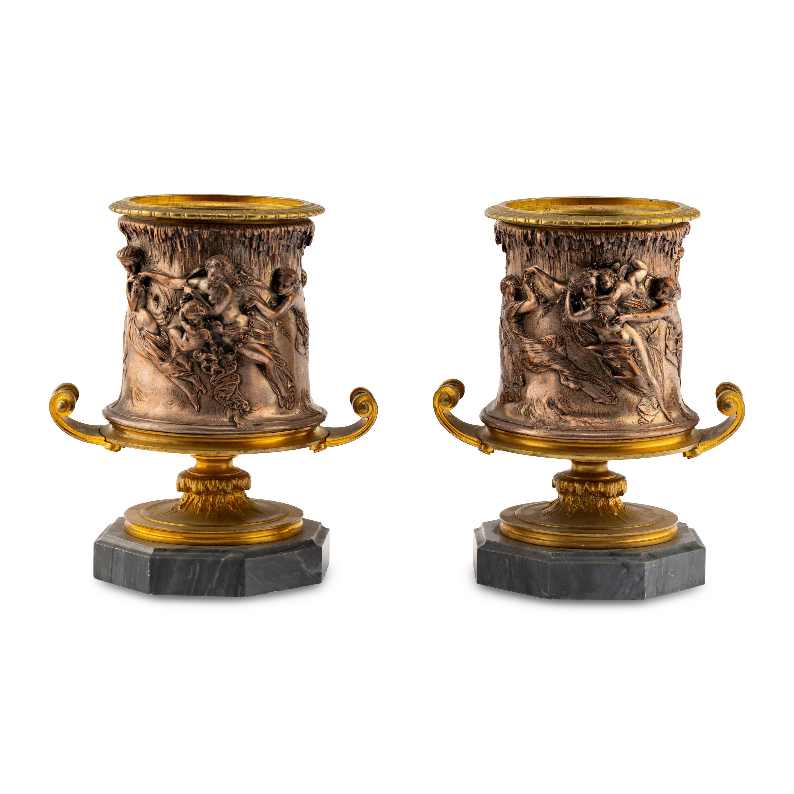 A Pair of French Gilt and Silvered Bronze Urns