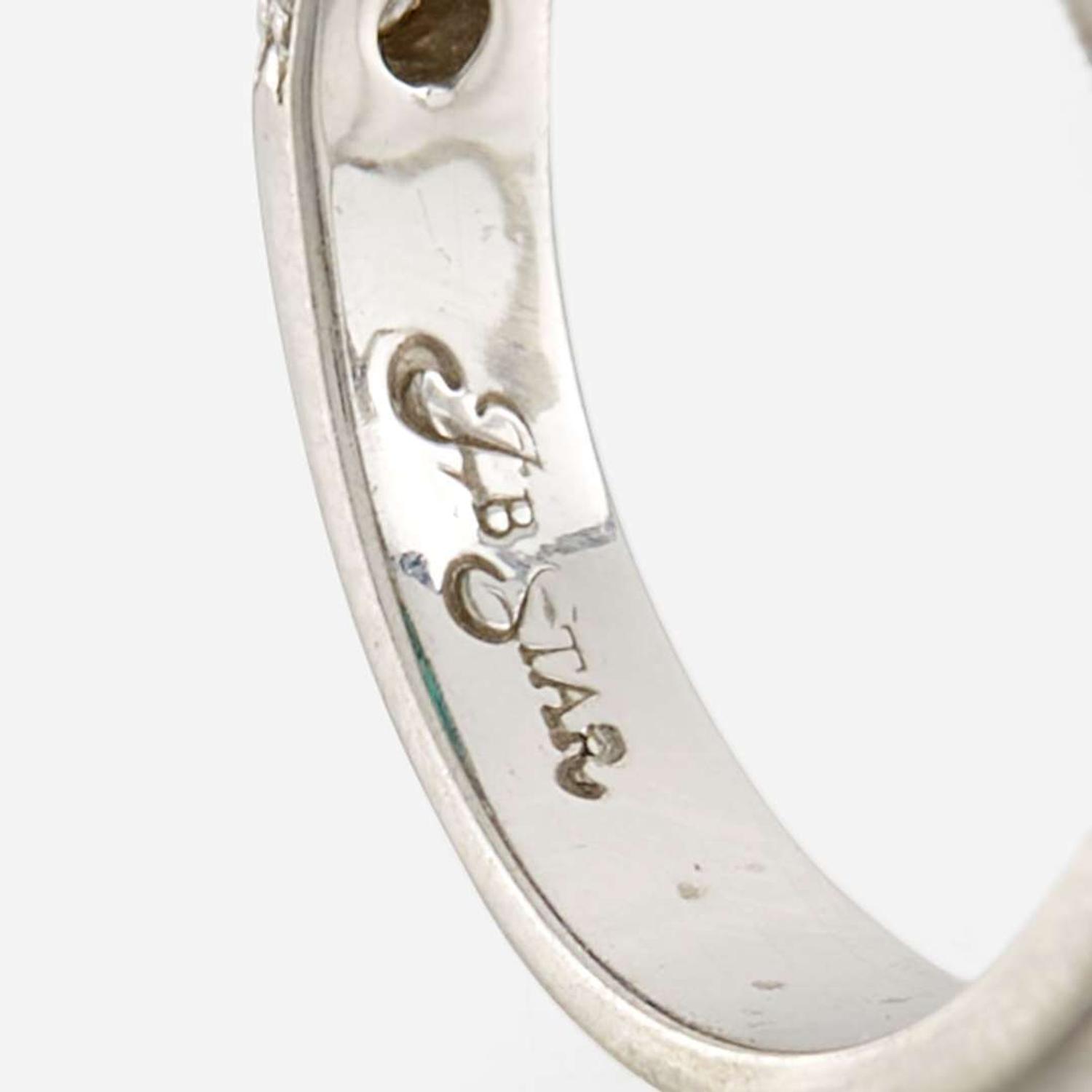 An emerald, diamond, and platinum ring, JB Star