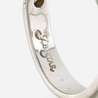 An emerald, diamond, and platinum ring, JB Star