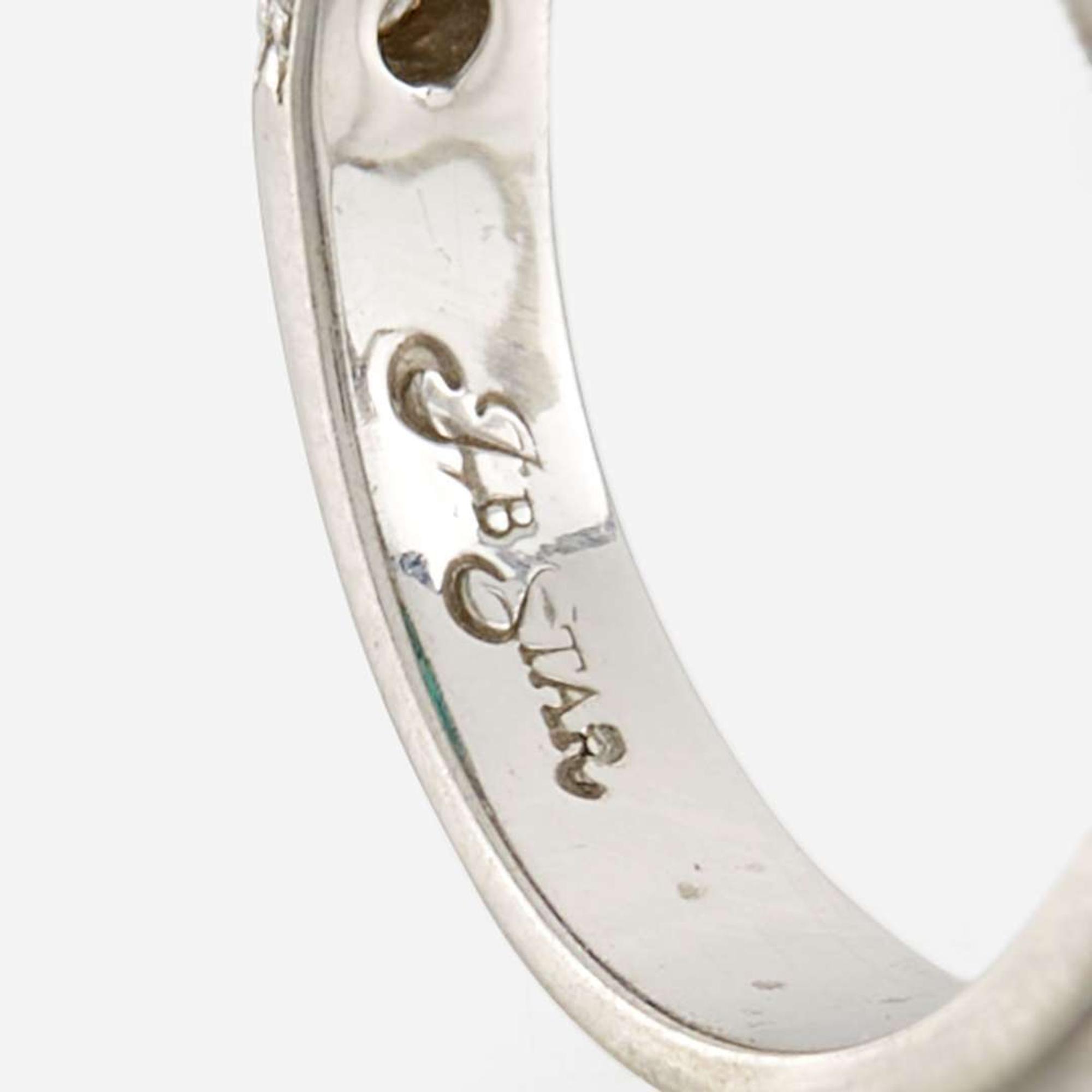 An emerald, diamond, and platinum ring, JB Star