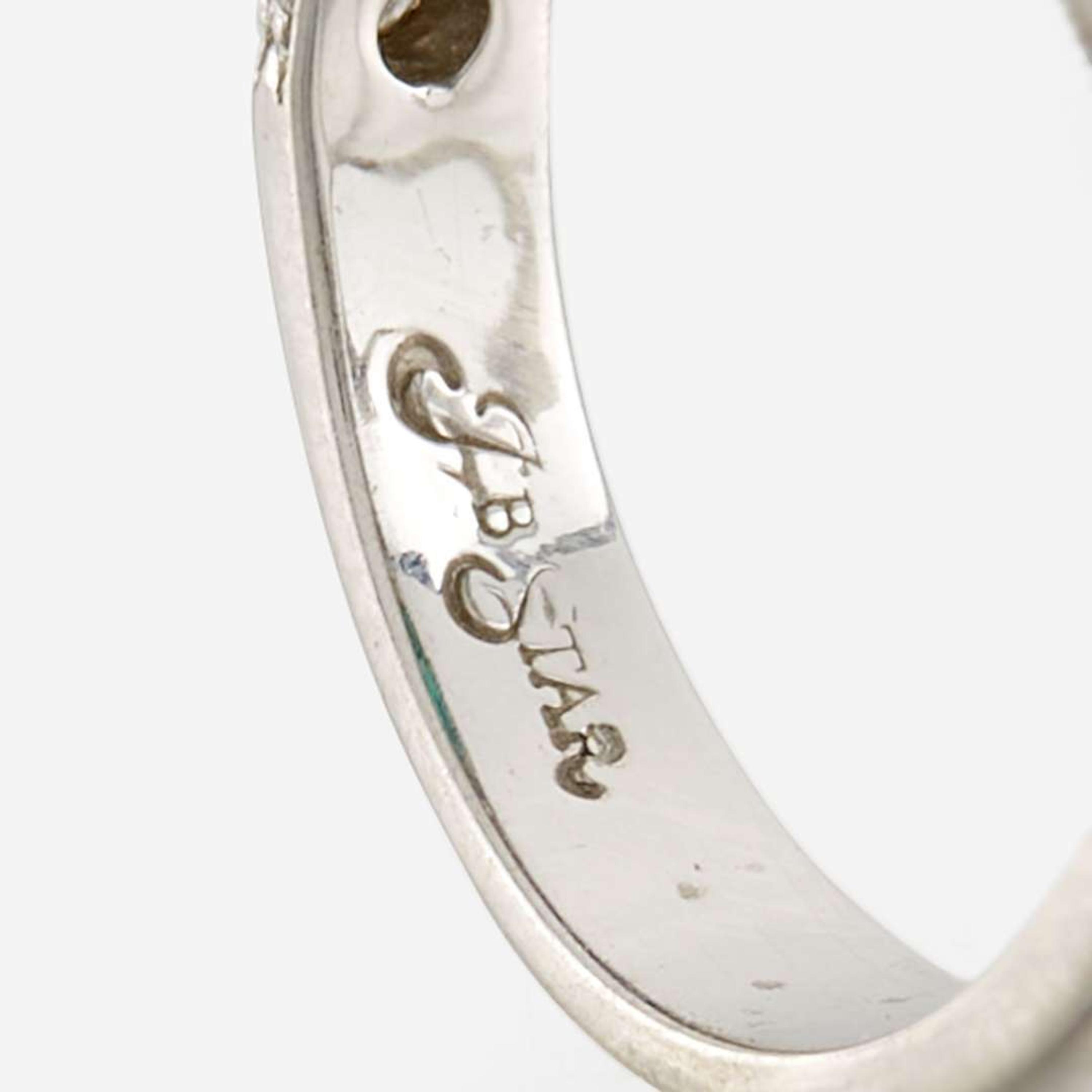 An emerald, diamond, and platinum ring, JB Star