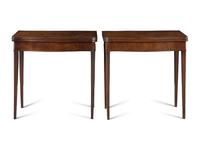 A Pair of George III Mahogany Games Tables