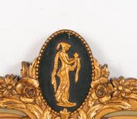 A Continental Gilt and Painted Mirror
