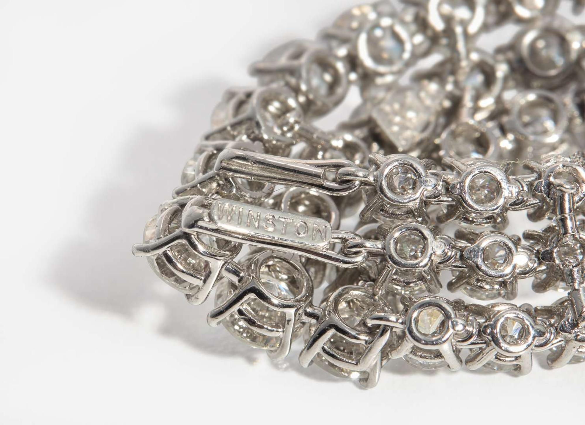 A Pair of Harry Winston Platinum and Diamond Earrings Harry Winston