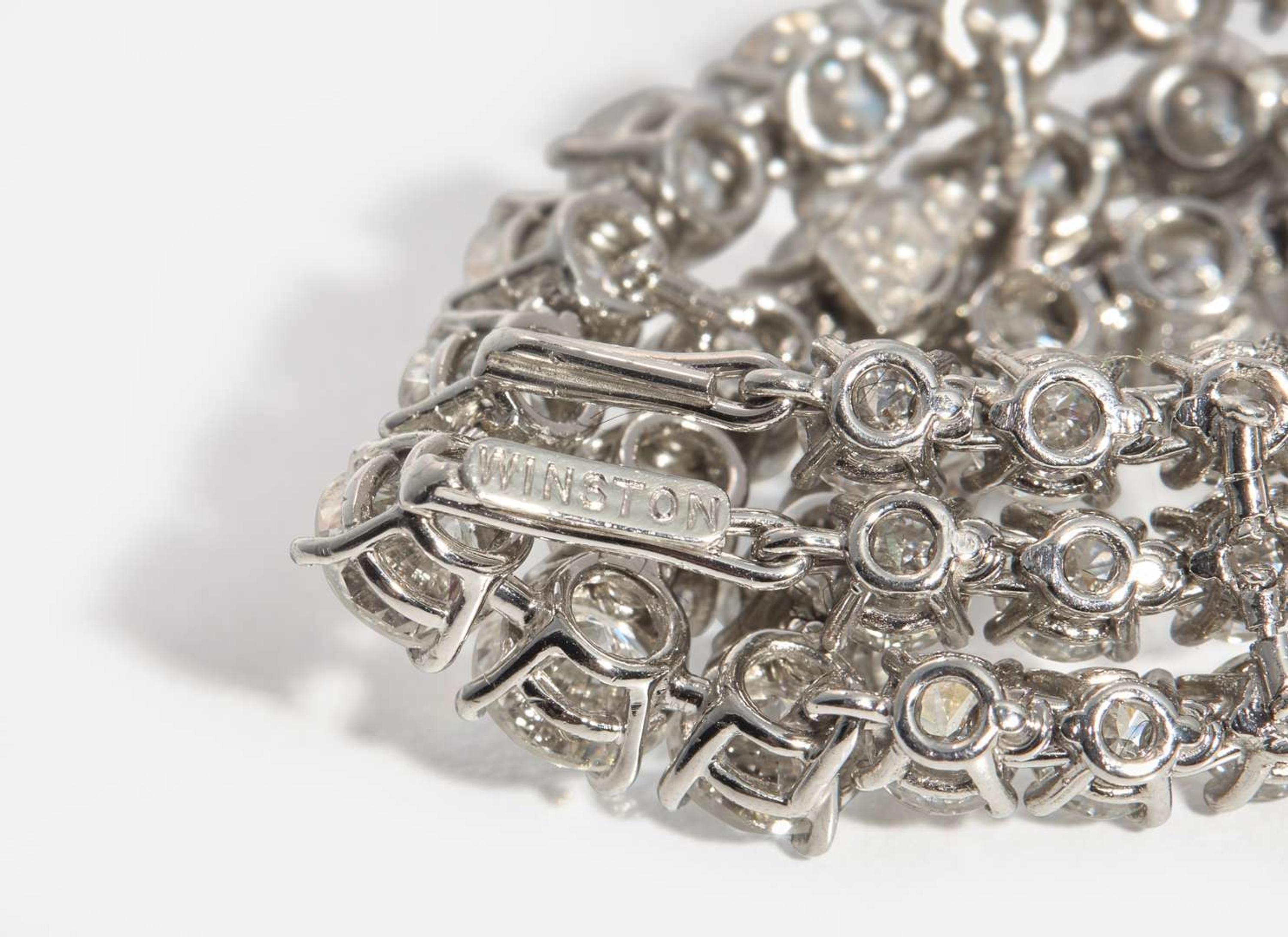 A Pair of Harry Winston Platinum and Diamond Earrings Harry Winston