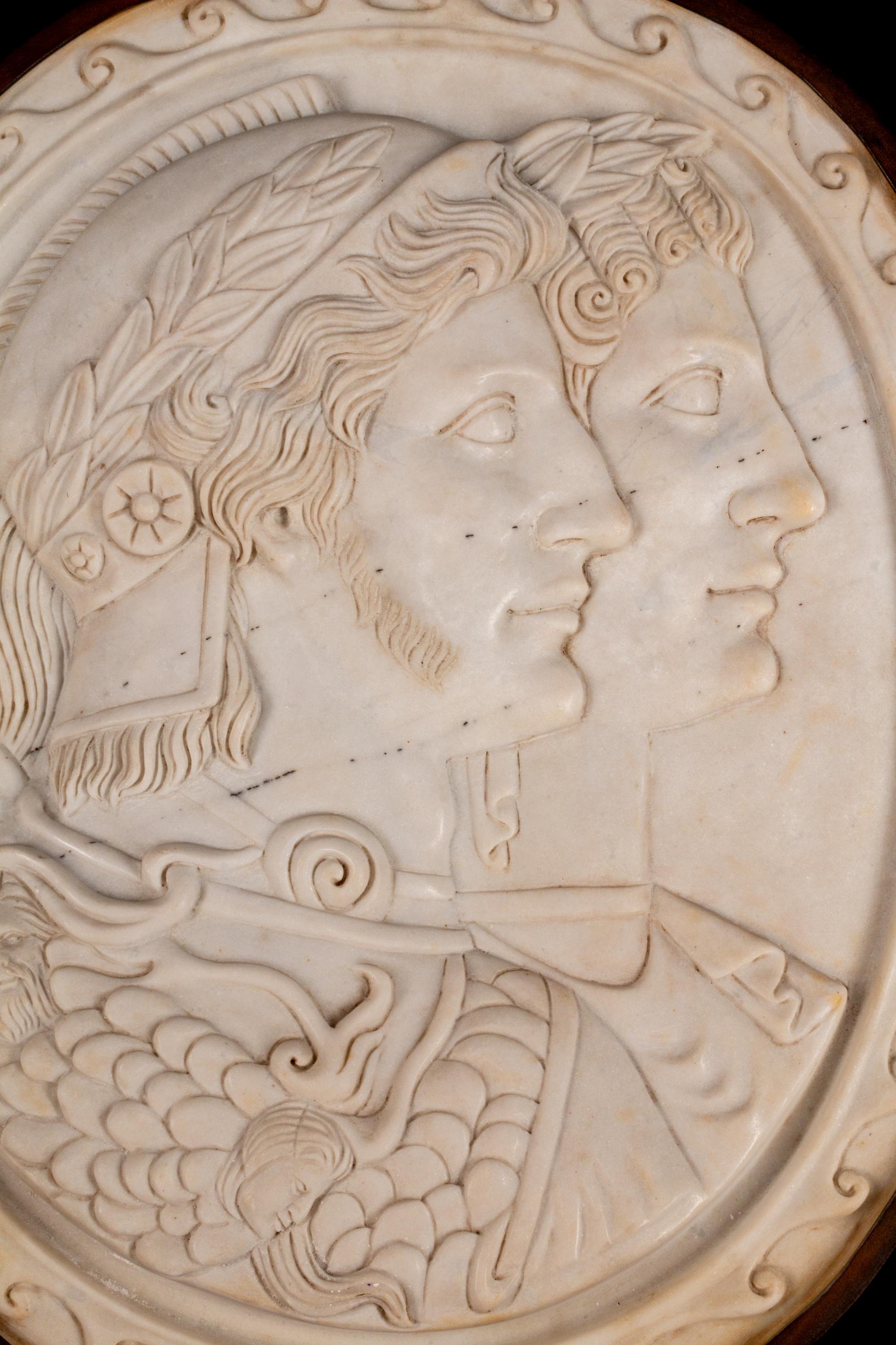 A Pair of Italian Neoclassical Style Iron-Mounted Marble Portrait Reliefs of a Caesar