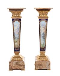 A Pair of Sèvres Style Gilt Bronze Mounted Painted and Parcel Gilt Porcelain and Onyx Pedestals