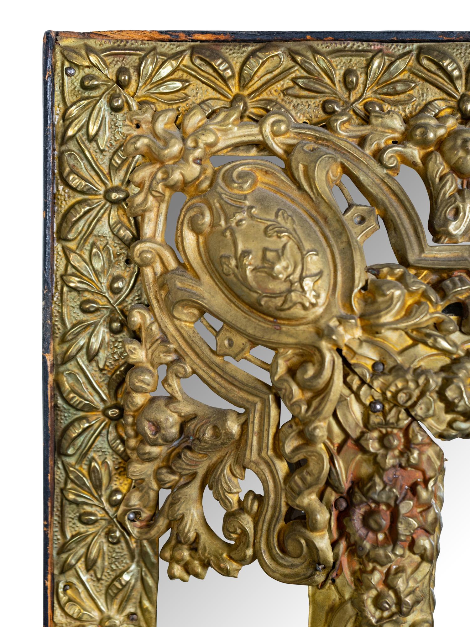 A Dutch Baroque Style Brass Repousse Mirror