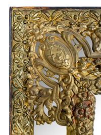 A Dutch Baroque Style Brass Repousse Mirror