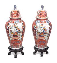 A Pair of Large Imari Palette Porcelain Jars with Wood Stands