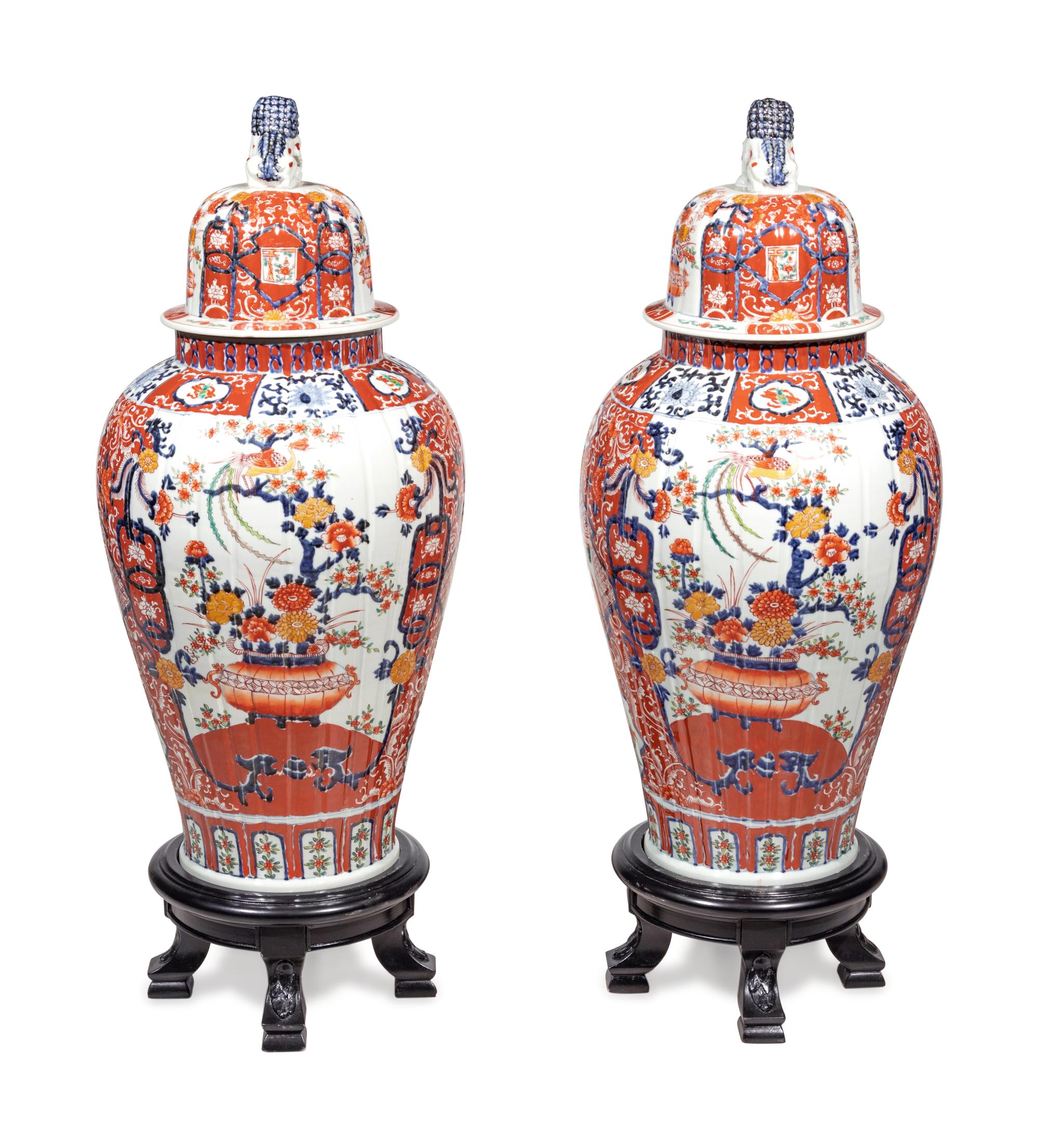 A Pair of Large Imari Palette Porcelain Jars with Wood Stands