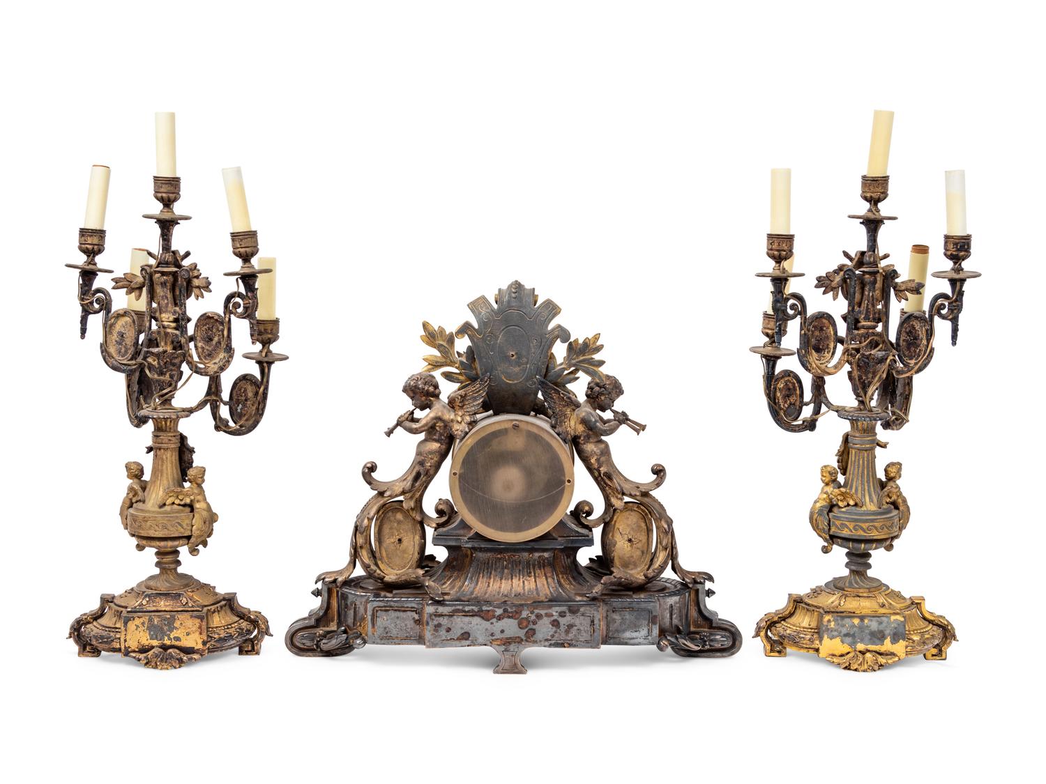 A Napoleon III Gilt Bronze and Enamel Clock Garniture
