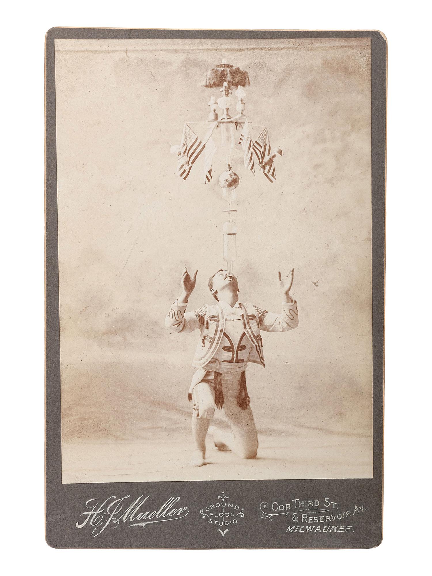 [EARLY PHOTOGRAPHY - CIRCUS ACTS & COSTUMES]. A collection of 50+ quirky and unusual photographs highlighted by circus performers, costumed subjects, and other oddities, including: