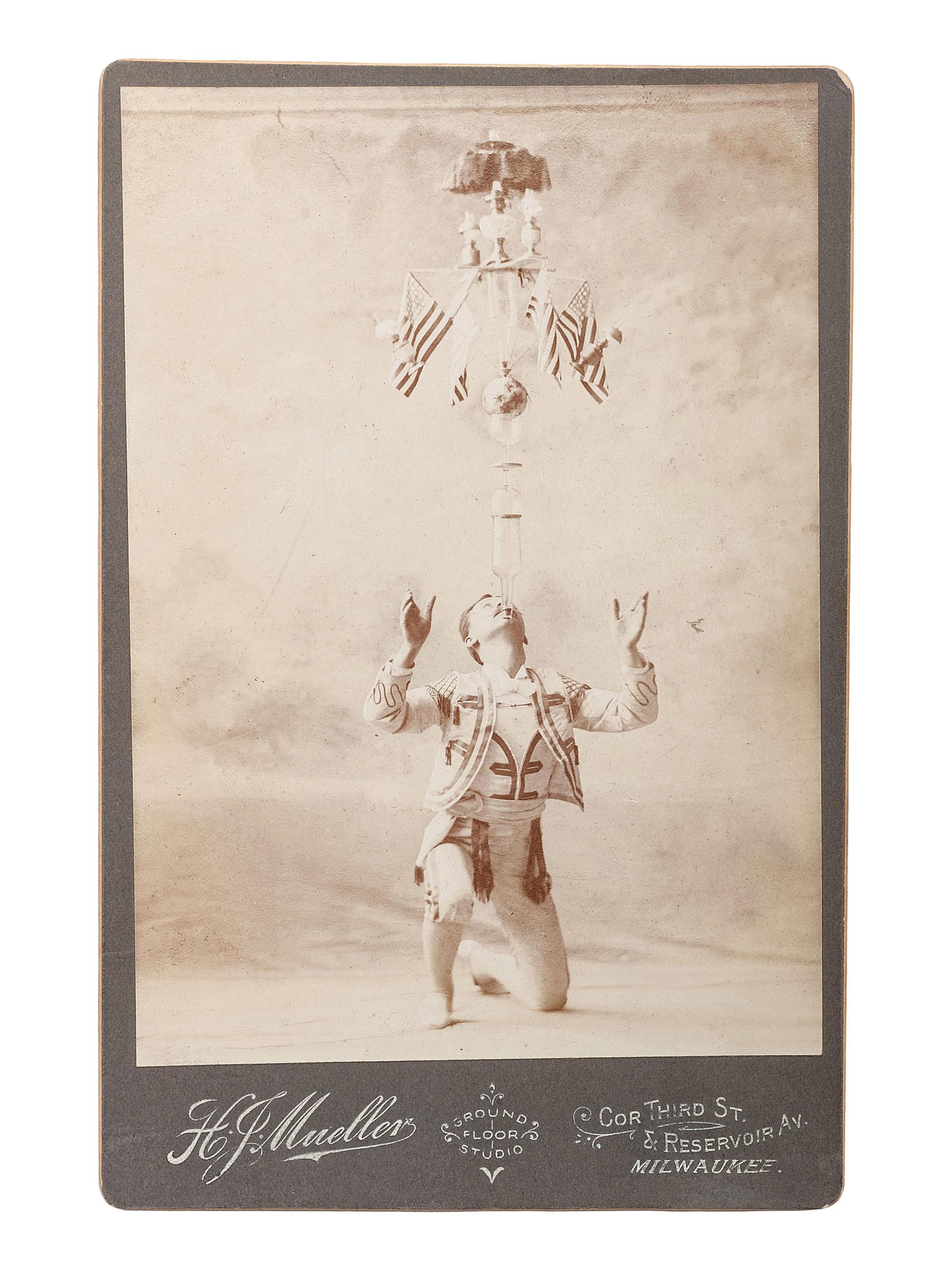 [EARLY PHOTOGRAPHY - CIRCUS ACTS & COSTUMES]. A collection of 50+ quirky and unusual photographs highlighted by circus performers, costumed subjects, and other oddities, including: