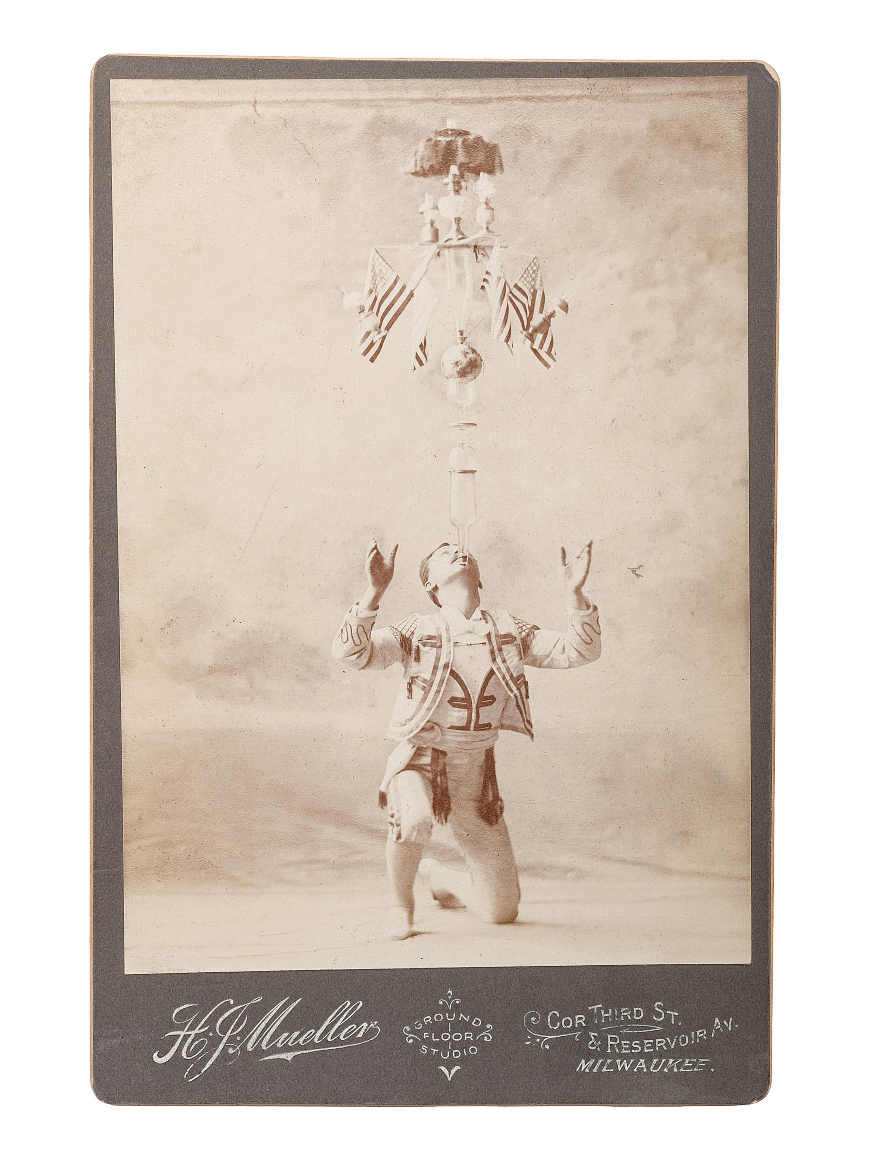 [EARLY PHOTOGRAPHY - CIRCUS ACTS & COSTUMES]. A collection of 50+ quirky and unusual photographs highlighted by circus performers, costumed subjects, and other oddities, including:
