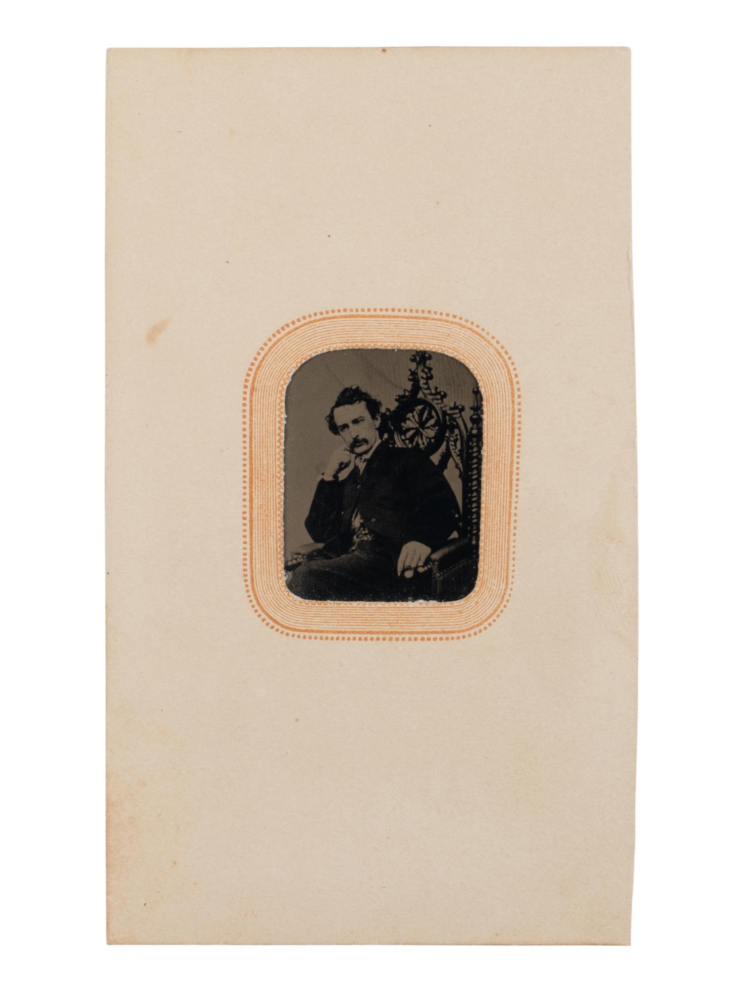 [BOOTH, John Wilkes (1838-1865)]. Tintype depicting a seated John Wilkes Booth, ca 1864.
