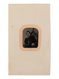 [BOOTH, John Wilkes (1838-1865)]. Tintype depicting a seated John Wilkes Booth, ca 1864.