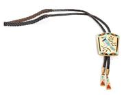 Zuni 18 Karat Yellow Gold Inlaid Bolo, Dennis Edaakie (b. 1931) Height 2 5/8 x width 2 inches