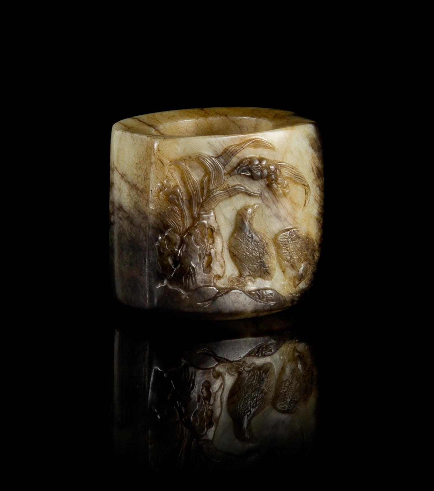 A Grey, Black and White Jade Archer's Ring Height 1 1/4 inches.