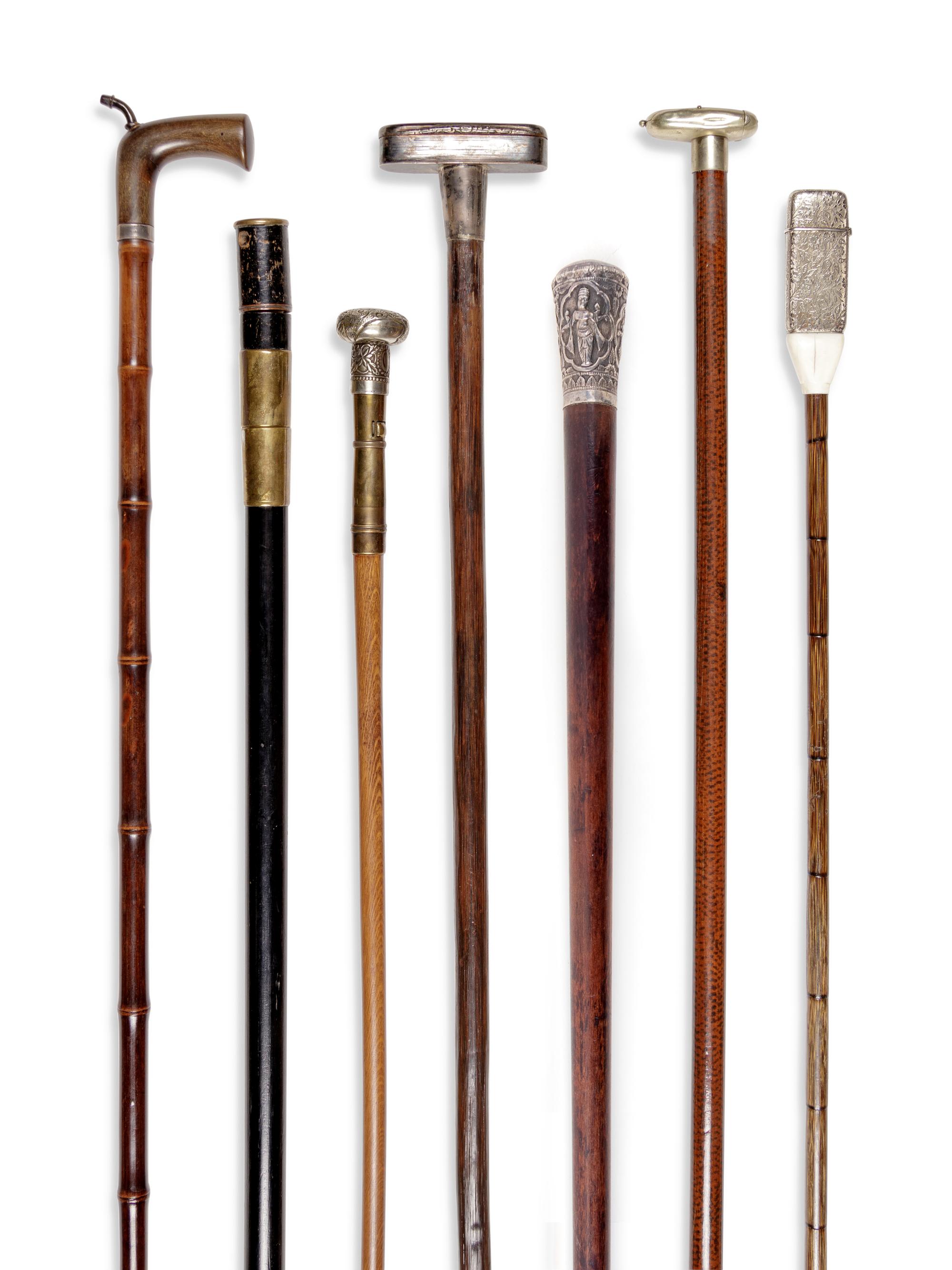 Seven Silvered Metal and Brass Mounted Smoker's System Walking Sticks
