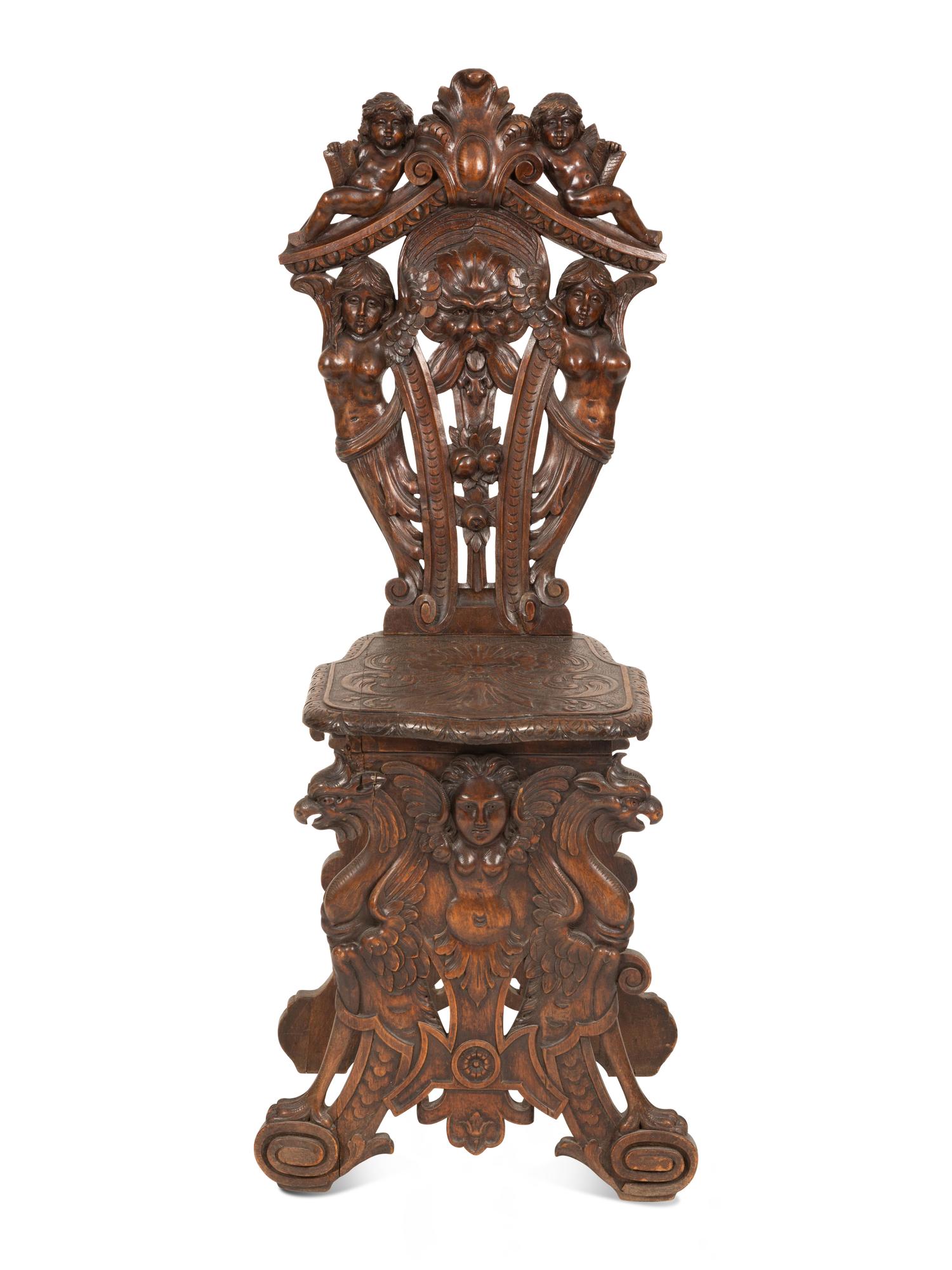 An Italian Renaissance Revival Carved Walnut Sgabello Hall Chair