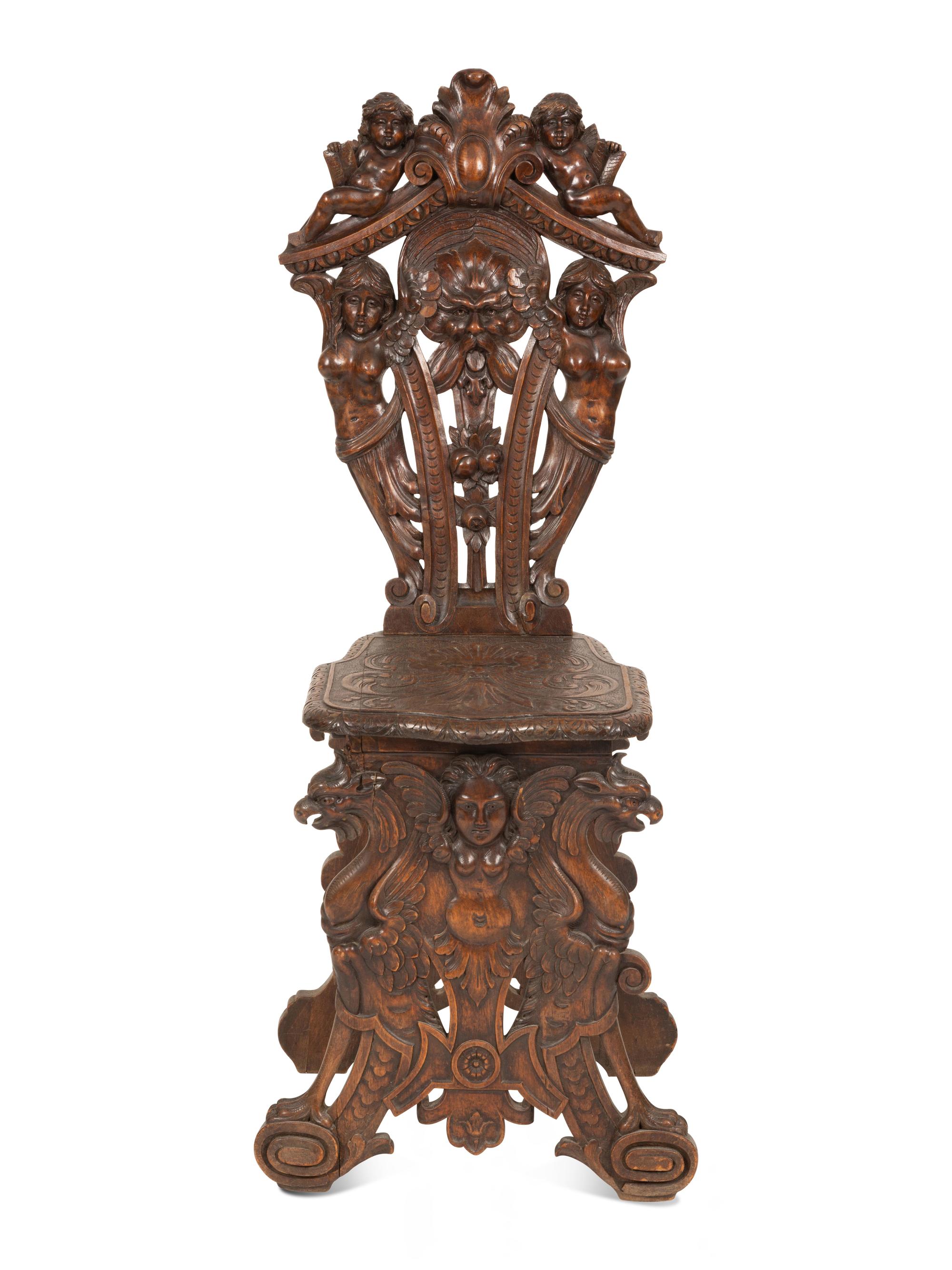 An Italian Renaissance Revival Carved Walnut Sgabello Hall Chair