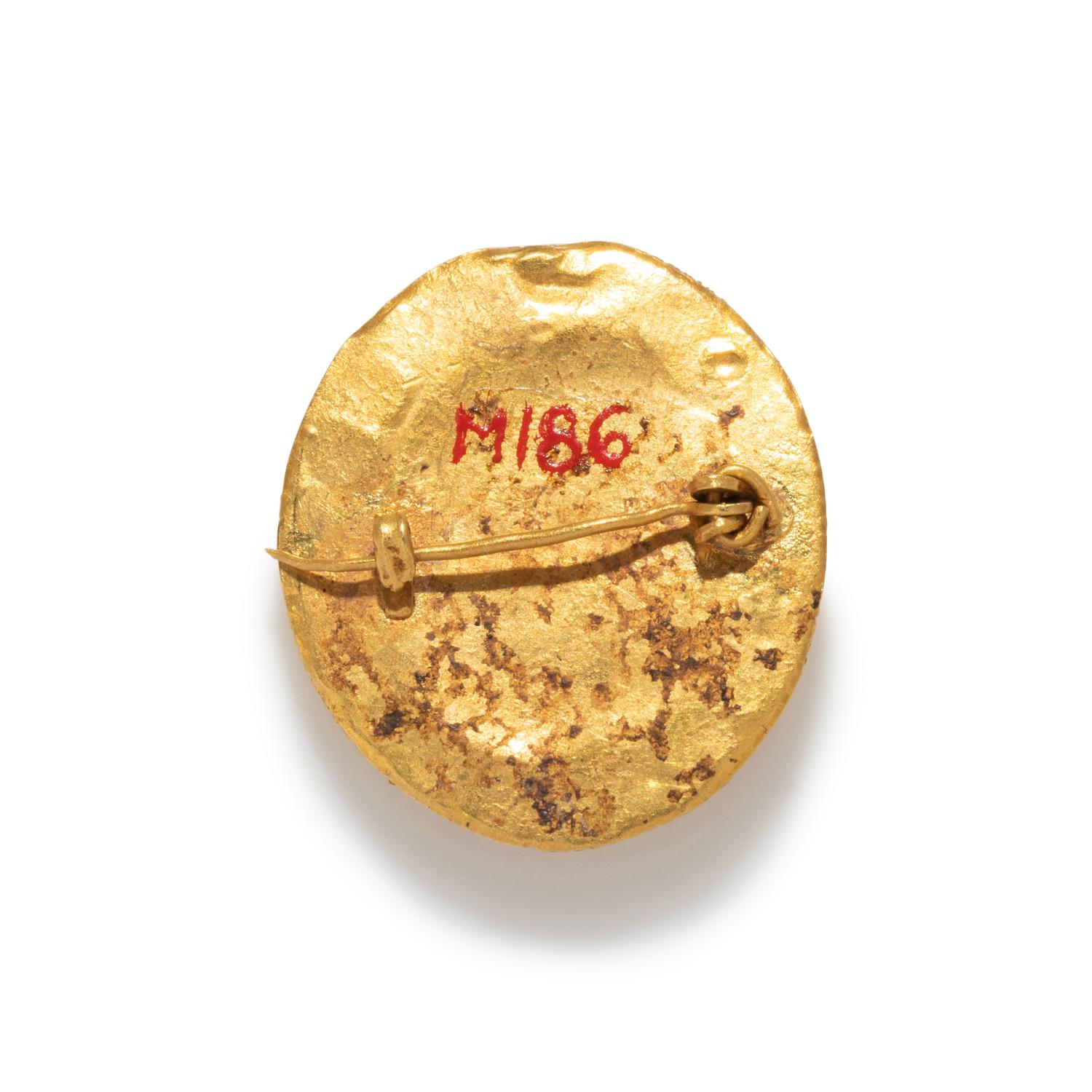 A Roman Gold and Glass Cameo Brooch with a Sleeping Dog